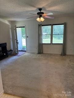2669 Icard Rhodhiss Rd, Connelly Springs, NC 28612 - unfurnished living room featuring ceiling fan and carpet floors