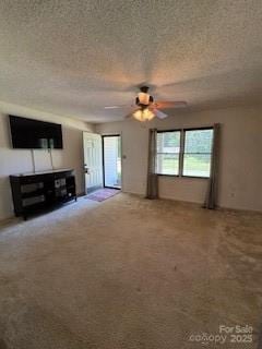 2669 Icard Rhodhiss Rd, Connelly Springs, NC 28612 - unfurnished living room featuring carpet flooring, ceiling fan, and a textured ceiling