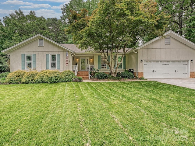 2911 Butter Churn Ln, Matthews, NC 28105 - ranch-style house with a porch, a garage, concrete driveway, and a front yard