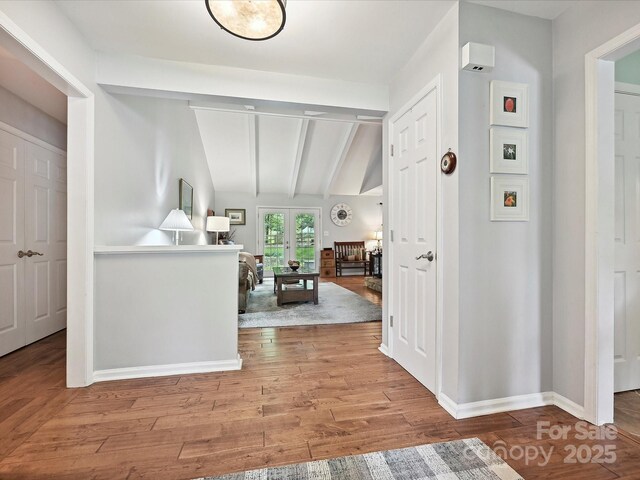 2911 Butter Churn Ln, Matthews, NC 28105 - corridor featuring wood finished floors, baseboards, and french doors