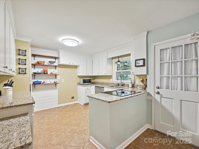 2911 Butter Churn Ln, Matthews, NC 28105 - kitchen with appliances with stainless steel finishes, a sink, a peninsula, white cabinetry, and light stone counters