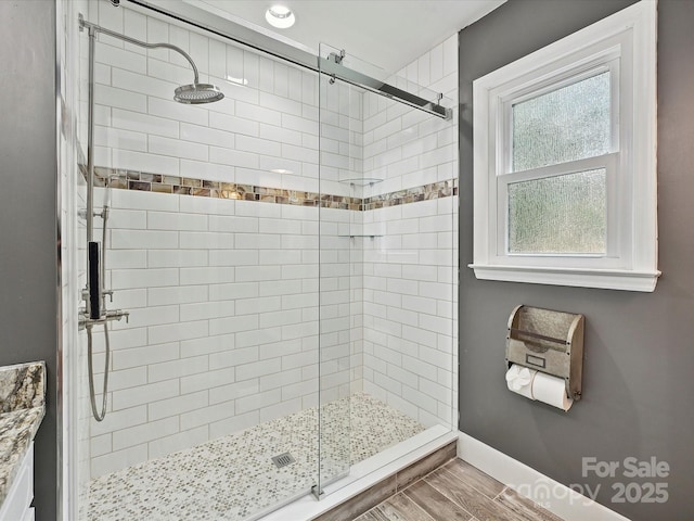2911 Butter Churn Ln, Matthews, NC 28105 - full bath featuring a shower stall, wood finished floors, and baseboards