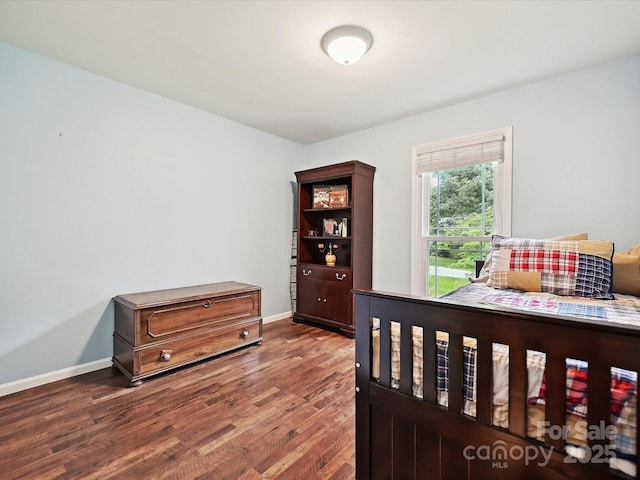 2911 Butter Churn Ln, Matthews, NC 28105 - bedroom featuring wood finished floors and baseboards
