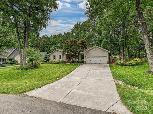 2911 Butter Churn Ln, Matthews, NC 28105 - view of front of house featuring driveway and an attached garage