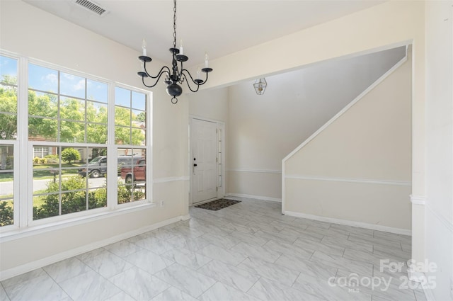 2013 Arbor Crest Ct, Charlotte, NC 28262 - unfurnished dining area with a chandelier, healthy amount of natural light, baseboards, and marble look tile flooring