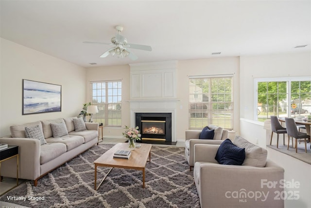 2013 Arbor Crest Ct, Charlotte, NC 28262 - living room with ceiling fan, a large fireplace, and baseboards