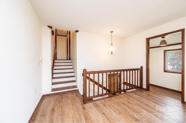 3020 Doc Pugh Rd, Connelly Springs, NC 28612 - staircase featuring wood finished floors and baseboards