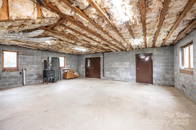 3020 Doc Pugh Rd, Connelly Springs, NC 28612 - below grade area with a wood stove and concrete block wall