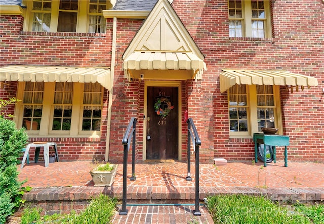 611 E Marion St, Shelby, NC 28150 - view of exterior entry with brick siding and a patio area