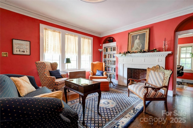611 E Marion St, Shelby, NC 28150 - living room with wood finished floors, a fireplace, crown molding, and baseboards