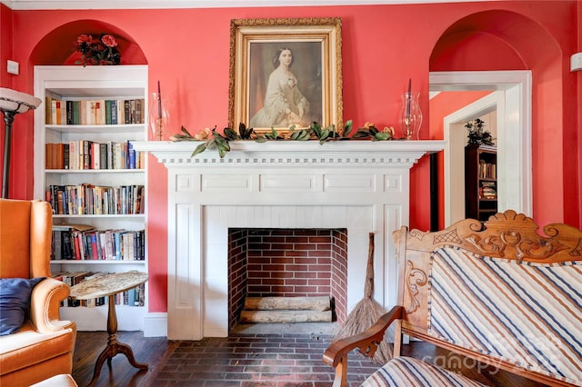 611 E Marion St, Shelby, NC 28150 - living area with a fireplace and brick flooring