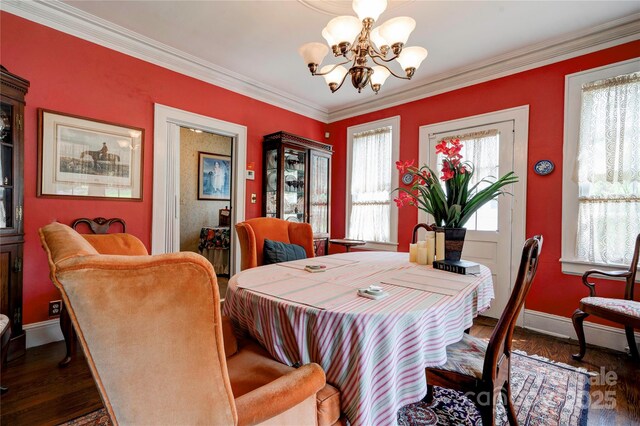 611 E Marion St, Shelby, NC 28150 - dining room featuring a chandelier, ornamental molding, wood finished floors, and baseboards