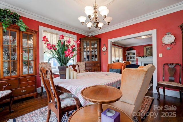 611 E Marion St, Shelby, NC 28150 - dining area featuring healthy amount of natural light, a chandelier, crown molding, and wood finished floors