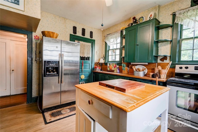 611 E Marion St, Shelby, NC 28150 - kitchen with green cabinetry, butcher block counters, appliances with stainless steel finishes, open shelves, and healthy amount of natural light