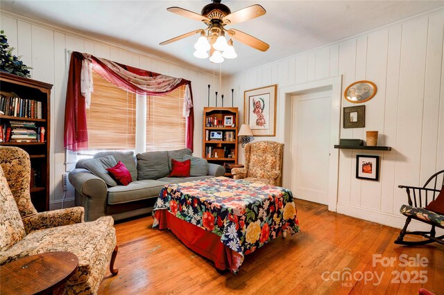 611 E Marion St, Shelby, NC 28150 - bedroom featuring hardwood / wood-style flooring, crown molding, a decorative wall, and ceiling fan