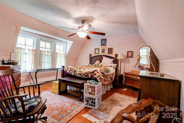 611 E Marion St, Shelby, NC 28150 - bedroom with wallpapered walls, vaulted ceiling, and wood finished floors