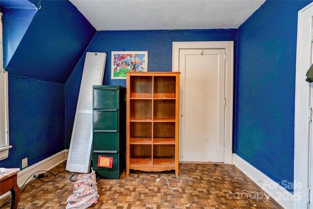 611 E Marion St, Shelby, NC 28150 - unfurnished bedroom with vaulted ceiling and baseboards