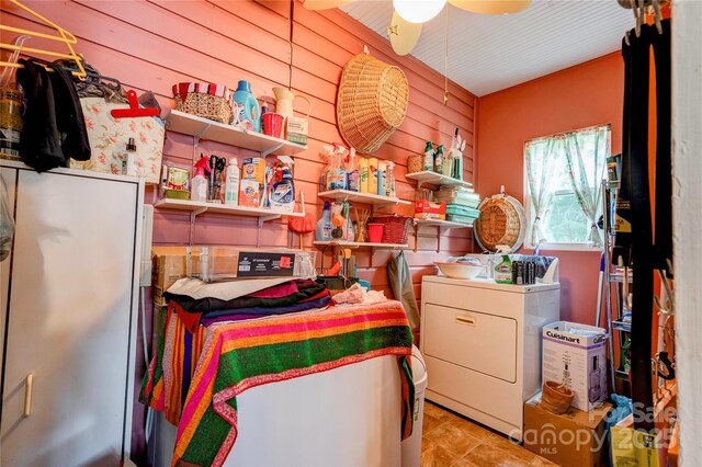 611 E Marion St, Shelby, NC 28150 - laundry room featuring washer / dryer, wooden walls, and a ceiling fan
