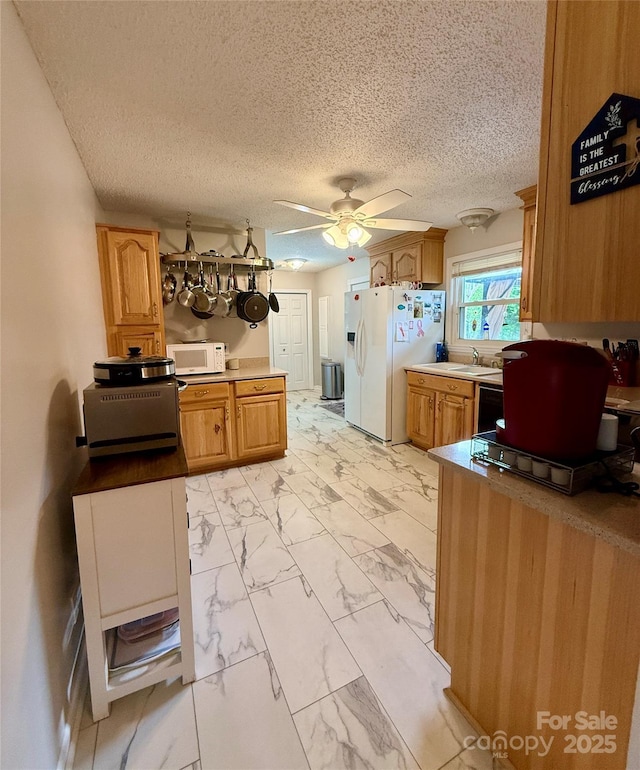 403 Kings Dr, Cherryville, NC 28021 - kitchen with white appliances, light marble finish floors, a ceiling fan, a sink, and a textured ceiling