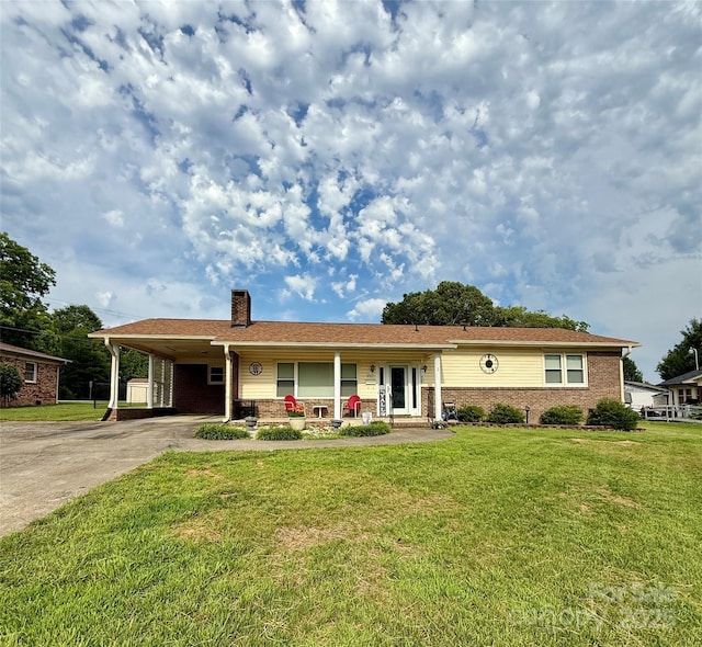 403 Kings Dr, Cherryville, NC 28021 - ranch-style house with a chimney, concrete driveway, a front yard, an attached carport, and brick siding
