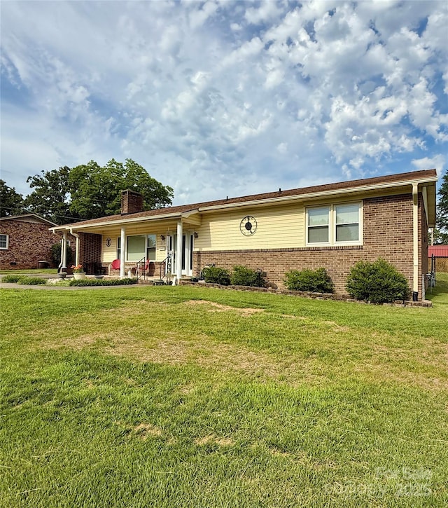 403 Kings Dr, Cherryville, NC 28021 - ranch-style house with brick siding, a chimney, and a front yard