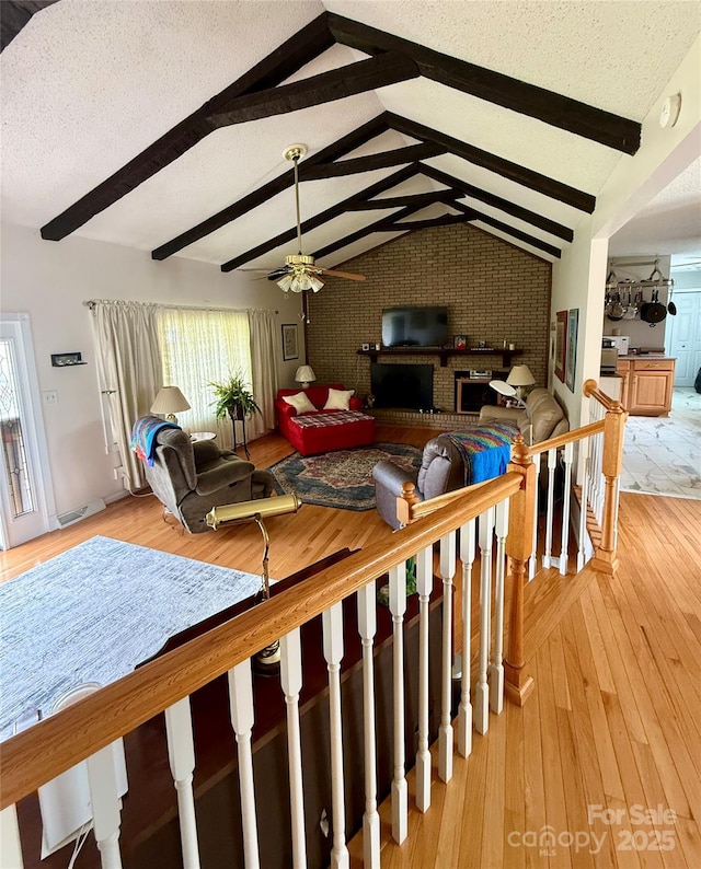403 Kings Dr, Cherryville, NC 28021 - living room with a ceiling fan, light wood-style floors, and a textured ceiling