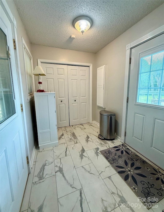 403 Kings Dr, Cherryville, NC 28021 - entryway featuring light marble finish floors and a textured ceiling