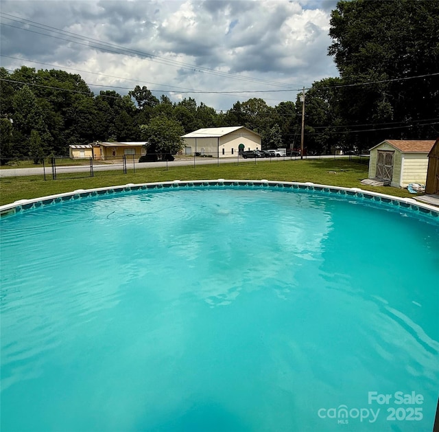 403 Kings Dr, Cherryville, NC 28021 - swimming pool featuring a storage shed and view of scattered trees
