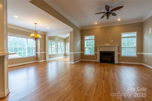 1009 Brookline Dr, Huntersville, NC 28078 - unfurnished living room featuring light wood-style flooring, ceiling fan, a chandelier, a fireplace with flush hearth, and ornamental molding
