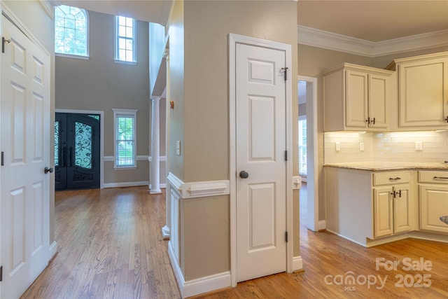 1009 Brookline Dr, Huntersville, NC 28078 - foyer with light wood-style floors and ornamental molding