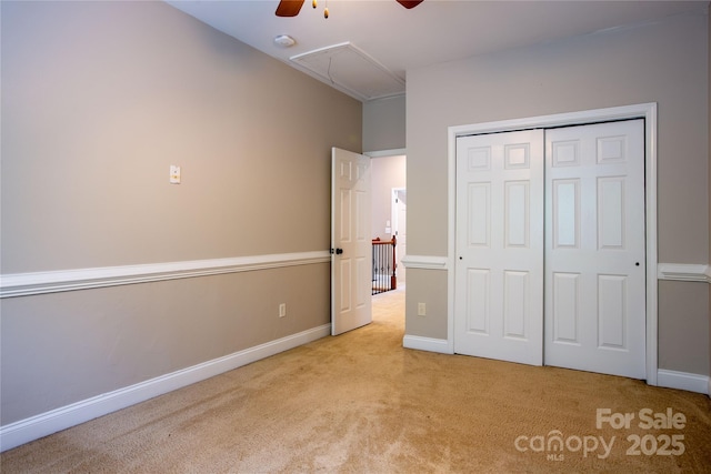 1009 Brookline Dr, Huntersville, NC 28078 - unfurnished bedroom featuring attic access, carpet flooring, a closet, and ceiling fan