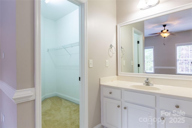 1009 Brookline Dr, Huntersville, NC 28078 - bathroom featuring vanity, a ceiling fan, and a walk in closet