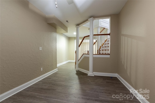 1009 Brookline Dr, Huntersville, NC 28078 - hall featuring a textured wall, dark wood-style floors, decorative columns, and stairs
