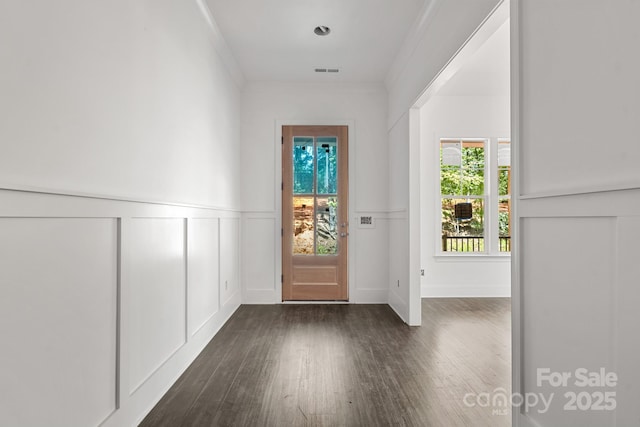 6782 Kingfisher Ct, Denver, NC 28037 - foyer entrance with dark wood-style flooring, wainscoting, ornamental molding, and a decorative wall