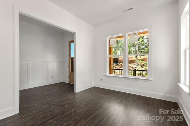 6782 Kingfisher Ct, Denver, NC 28037 - empty room with dark wood finished floors, baseboards, and wainscoting