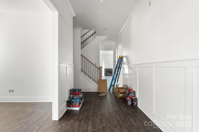 6782 Kingfisher Ct, Denver, NC 28037 - staircase featuring wood finished floors, a wainscoted wall, and a decorative wall