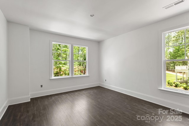 6782 Kingfisher Ct, Denver, NC 28037 - spare room with healthy amount of natural light, baseboards, and dark wood-style flooring