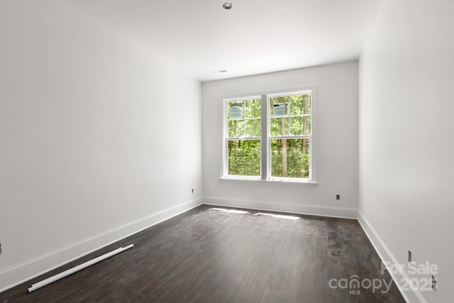 6782 Kingfisher Ct, Denver, NC 28037 - spare room featuring dark wood-style floors and baseboards