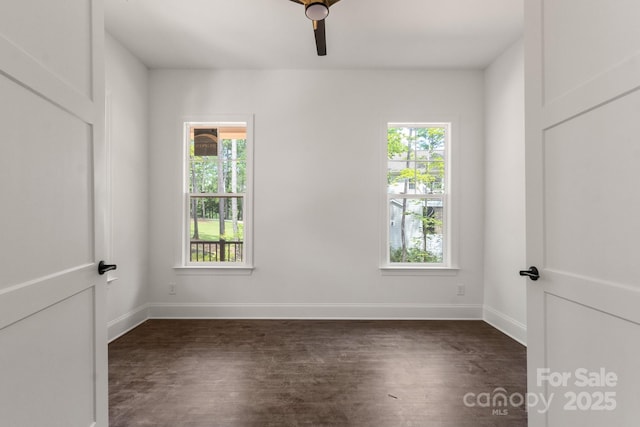 6782 Kingfisher Ct, Denver, NC 28037 - empty room featuring dark wood-style floors, plenty of natural light, and ceiling fan