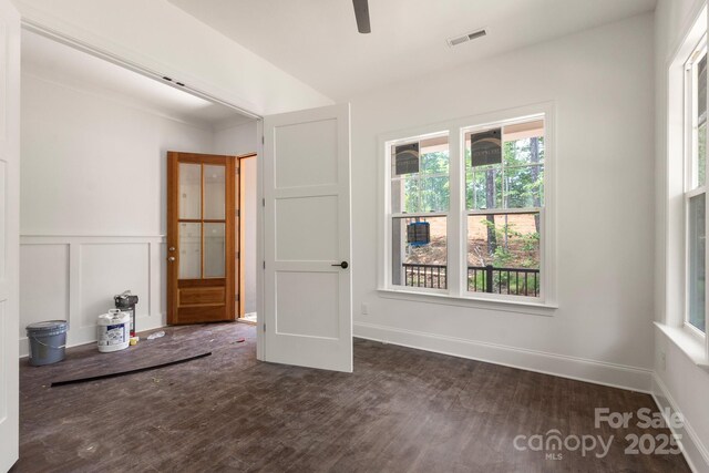 6782 Kingfisher Ct, Denver, NC 28037 - spare room with plenty of natural light, a ceiling fan, wood finished floors, and a wainscoted wall