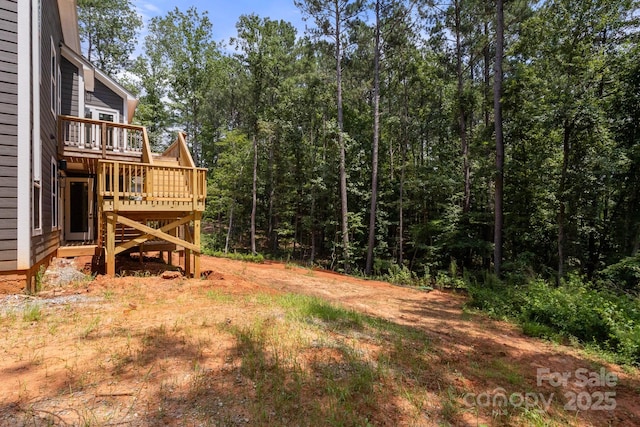 6782 Kingfisher Ct, Denver, NC 28037 - view of yard with a wooden deck and a view of trees