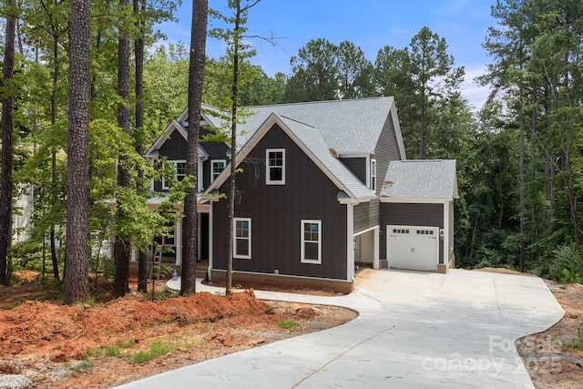 6782 Kingfisher Ct, Denver, NC 28037 - view of front of home with a garage, board and batten siding, concrete driveway, and a shingled roof