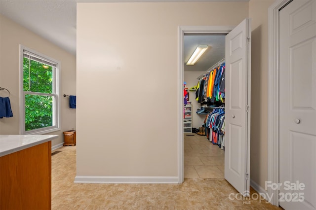 2 Candlestick Dr, Zirconia, NC 28790 - corridor featuring baseboards and light tile patterned flooring