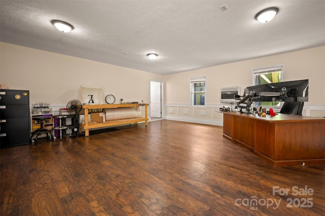 2 Candlestick Dr, Zirconia, NC 28790 - home office featuring wood finished floors, heating unit, a wainscoted wall, a textured ceiling, and a decorative wall