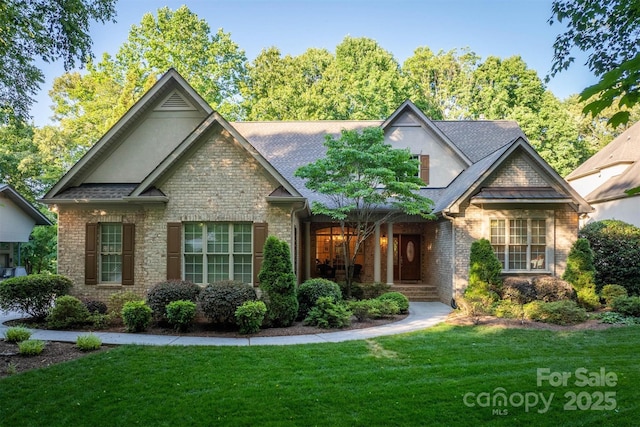 9002 Fair Oak Dr, Sherrills Ford, NC 28673 - craftsman inspired home with a front lawn, stone siding, and stucco siding