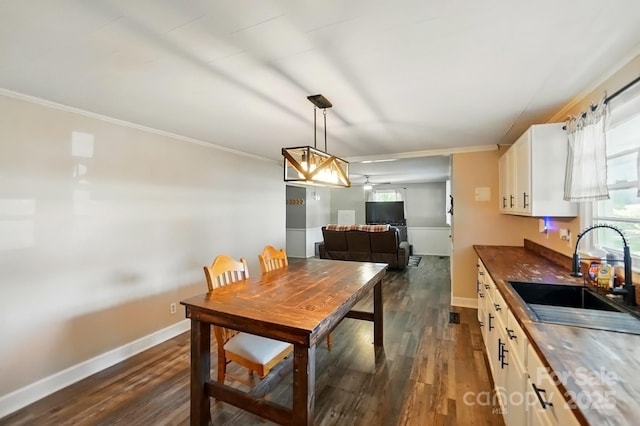 2903 Price Rushing Rd, Monroe, NC 28110 - dining area with dark wood-style floors, crown molding, and baseboards