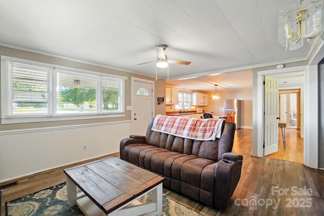 2903 Price Rushing Rd, Monroe, NC 28110 - living room featuring crown molding, light wood-style floors, ceiling fan, and baseboards