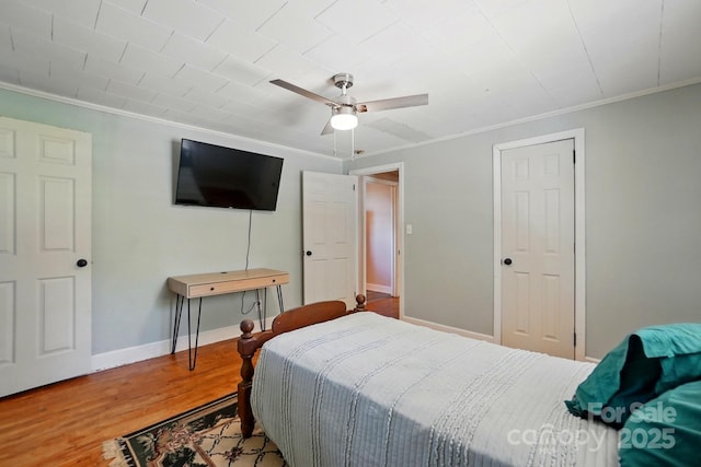2903 Price Rushing Rd, Monroe, NC 28110 - bedroom featuring crown molding, wood finished floors, baseboards, and ceiling fan