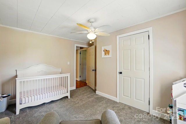 2903 Price Rushing Rd, Monroe, NC 28110 - bedroom featuring carpet flooring, ornamental molding, baseboards, a crib, and ceiling fan