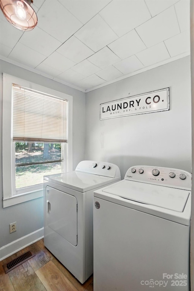 2903 Price Rushing Rd, Monroe, NC 28110 - laundry room with separate washer and dryer, wood finished floors, baseboards, and crown molding